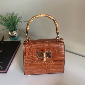 Crocodile style embossed handbag